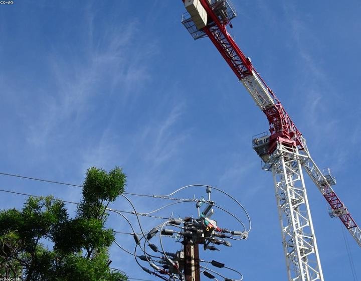 Engineering and construction site with tower crane and steel structure